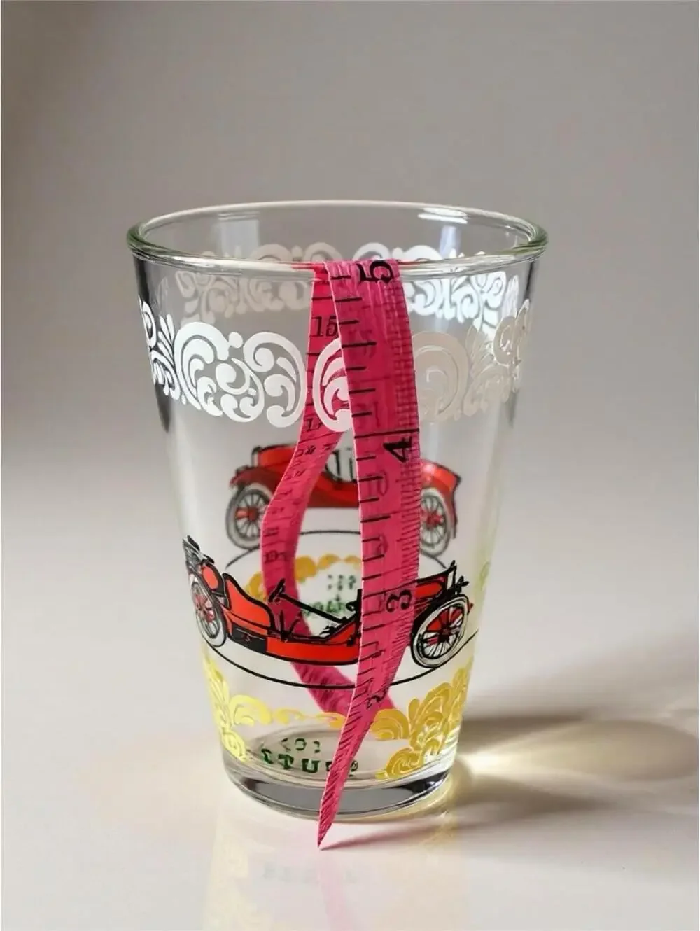 Vintage glass tumblers with early automobile designs 3